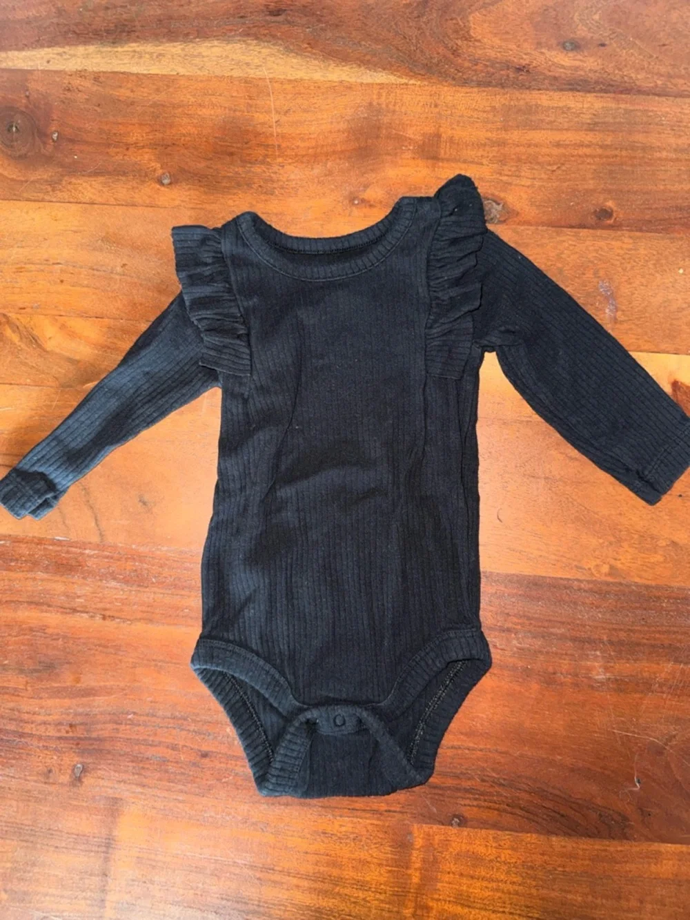 Black Ruffle‎ Shoulder Ribbed One-Piece Bodysuit - Kids